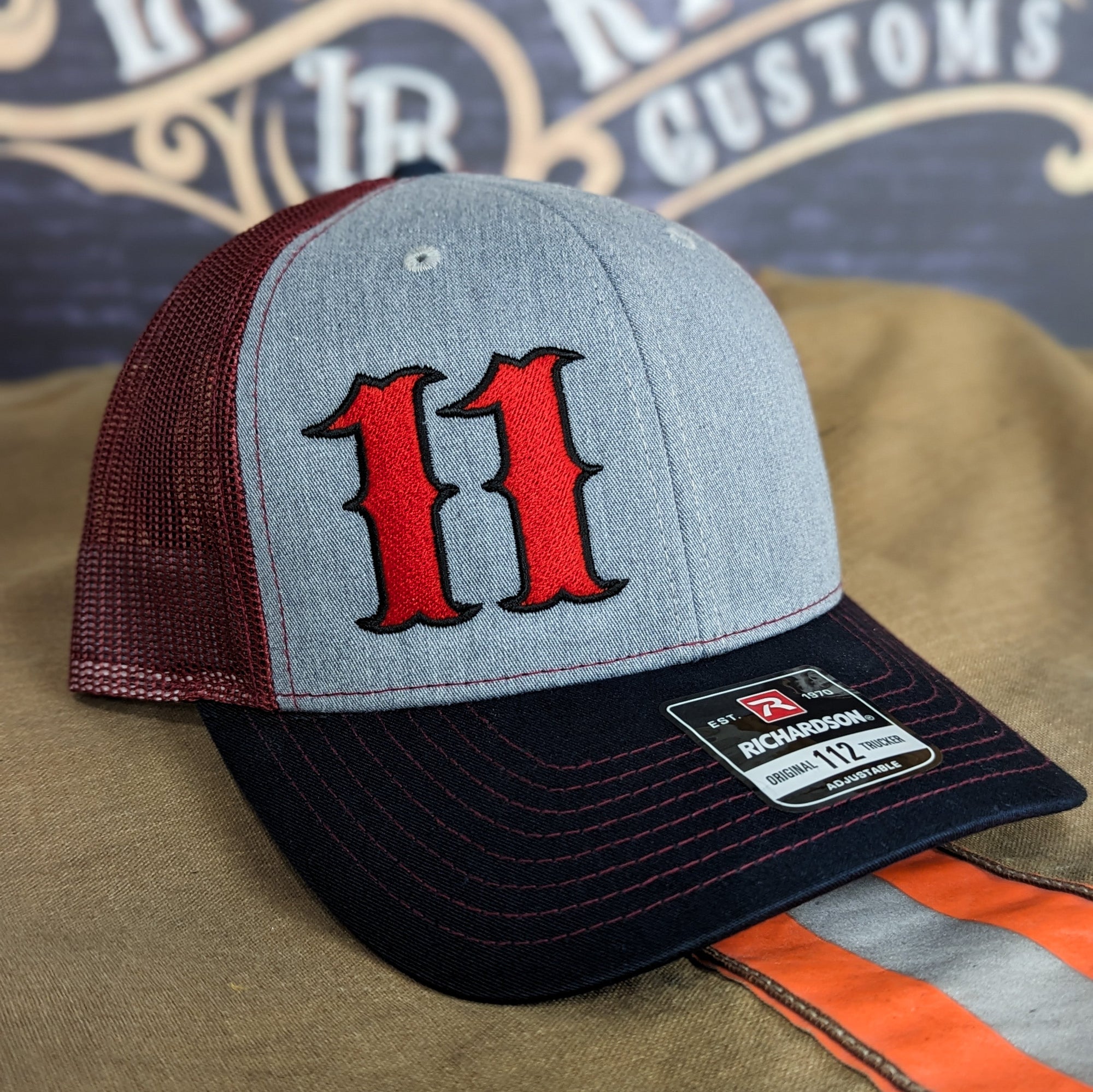 Custom embroidered firefighter hat with bold stitching, structured fit, and premium Richardson snapback design