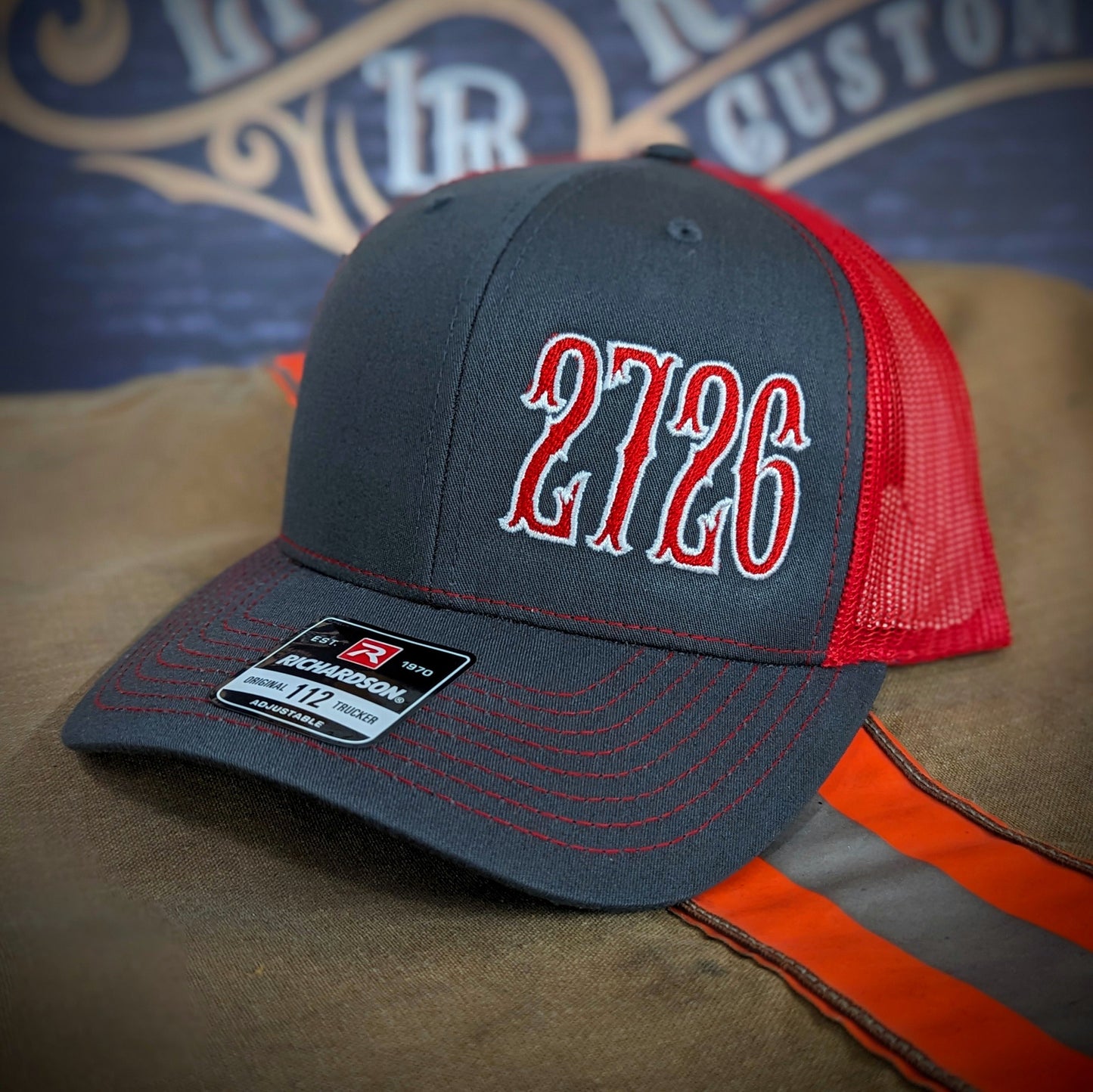 Custom embroidered firefighter hat with bold stitching, structured fit, and premium Richardson snapback design