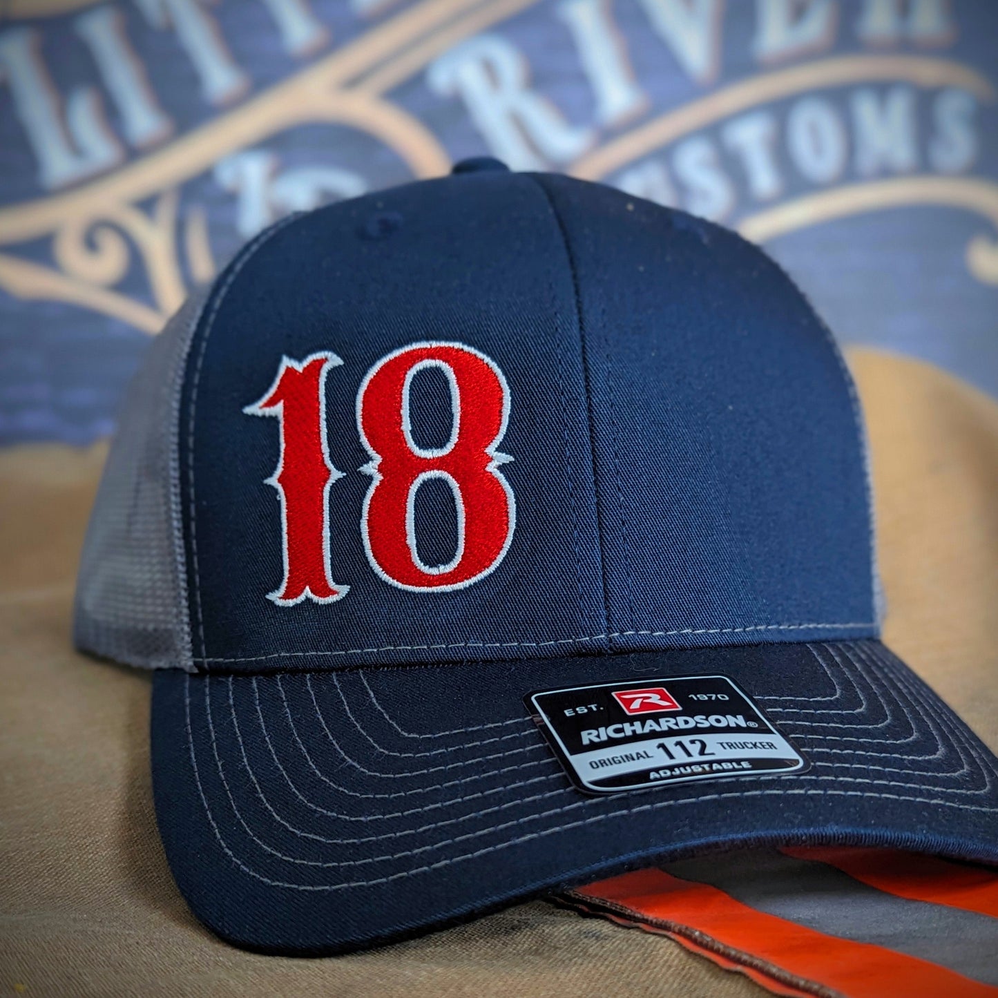 Custom embroidered firefighter hat with bold stitching, structured fit, and premium Richardson snapback design