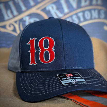 Custom embroidered firefighter hat with bold stitching, structured fit, and premium Richardson snapback design