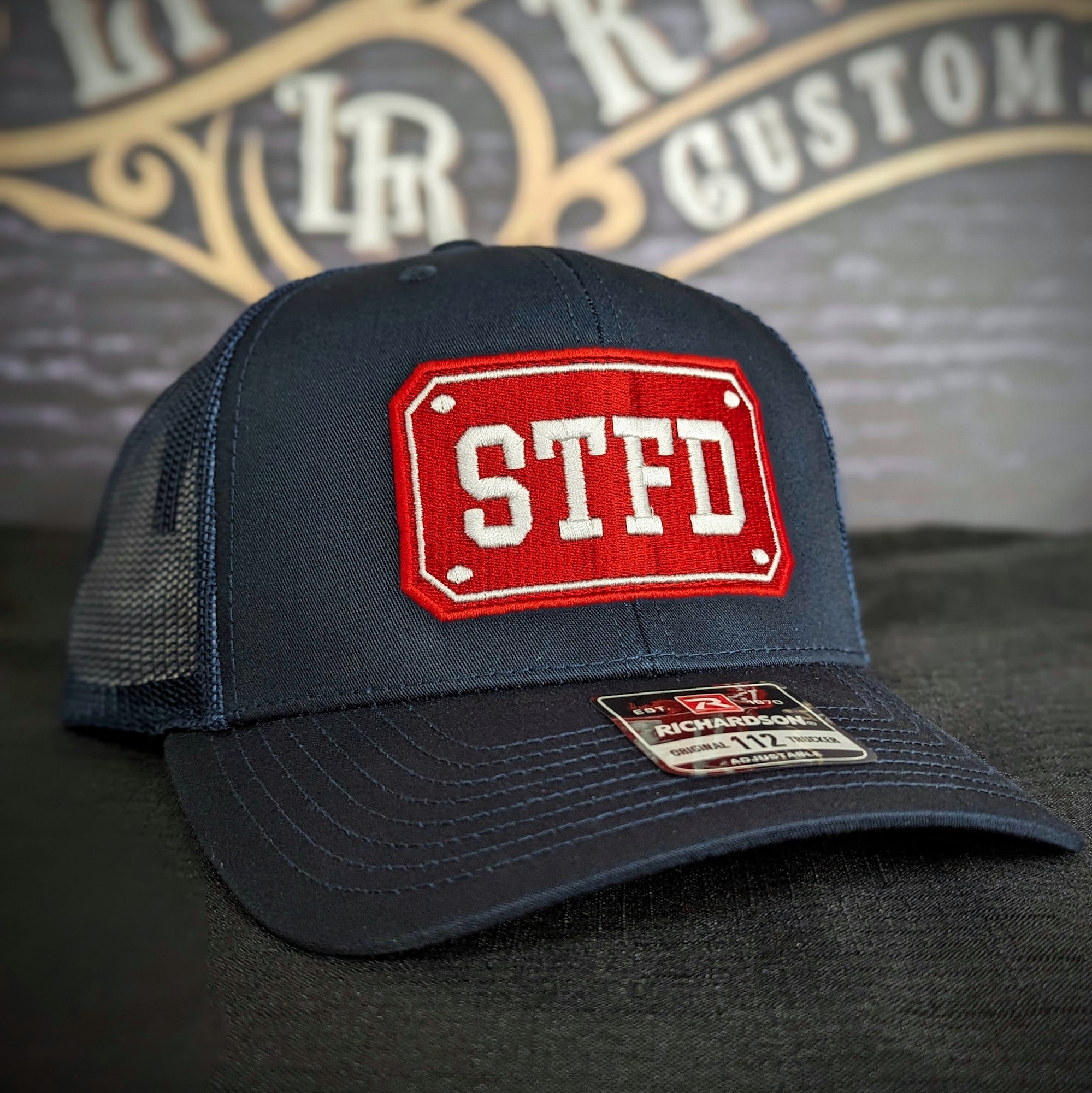 Custom embroidered firefighter hat with bold stitching, structured fit, and premium Richardson snapback design