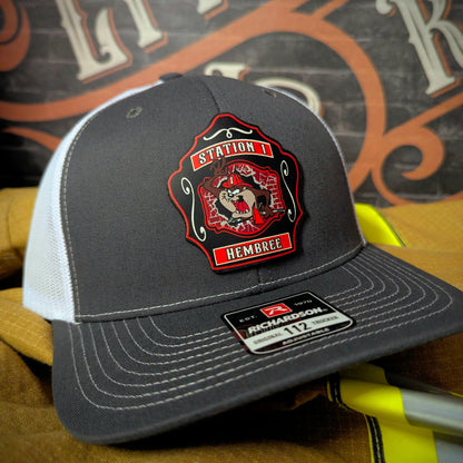 Custom firefighter hat for Western Taney Station 1. Features bold department artwork on a full-grain leather patch. Built for comfort, pride, and daily wear.