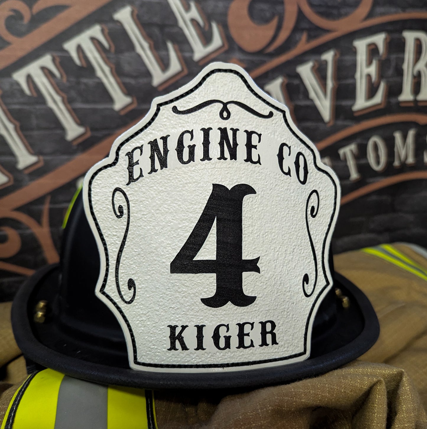 Custom Leather fire helmet shield with department name, rank, and company number