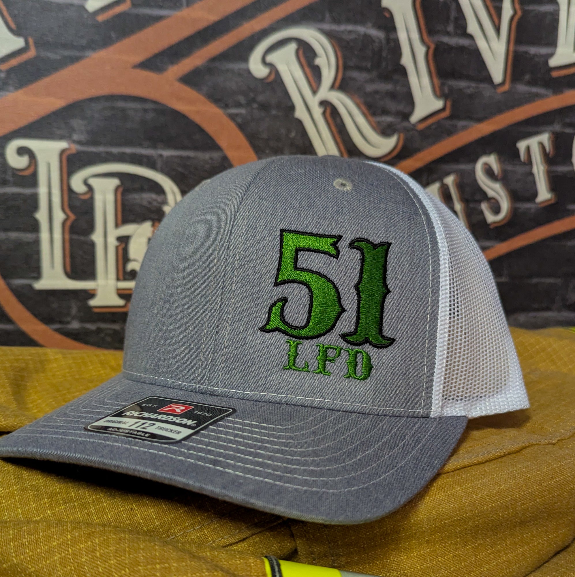Custom embroidered firefighter hat with bold stitching, structured fit, and premium Richardson snapback design