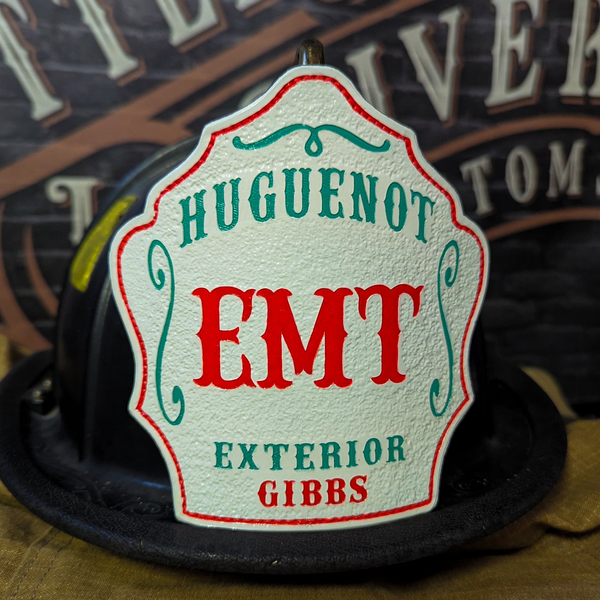 Custom Leather fire helmet shield with department name, rank, and company number