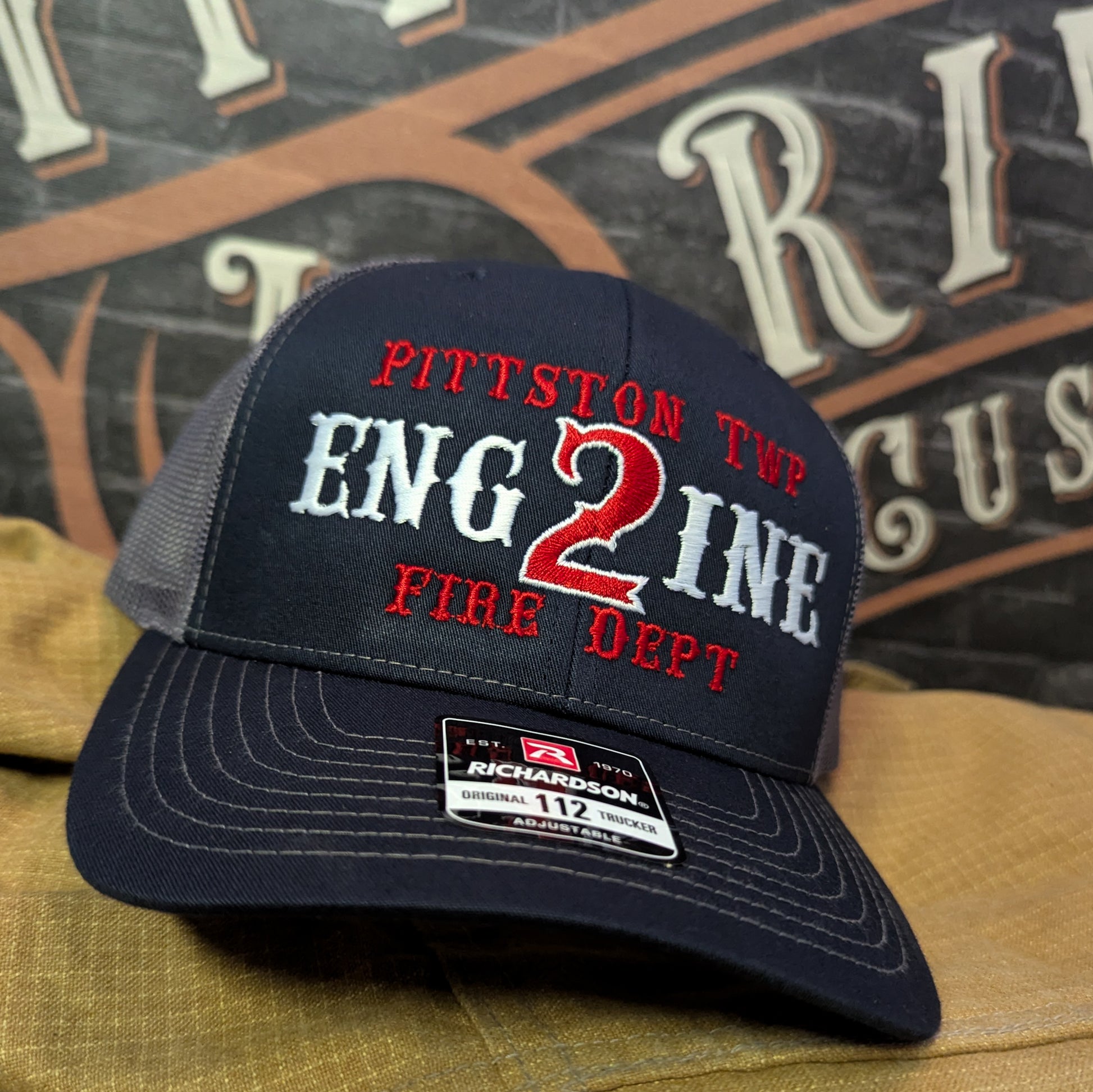 Custom embroidered firefighter hat with bold stitching, structured fit, and premium Richardson snapback design