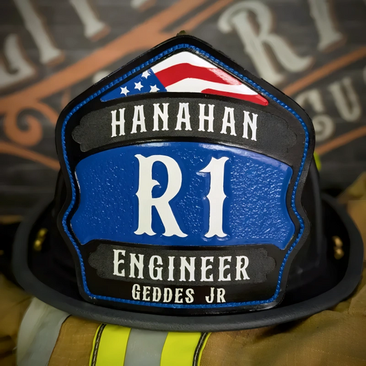 Renegade custom leather firefighter helmet shield with rocker layout, American flag detail, and blue leather design for engineer rank.