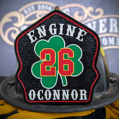 Traditional firefighter shield with shamrock design and clear lettering