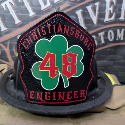 Real leather firefighter helmet shield styled in shamrock format for station pride