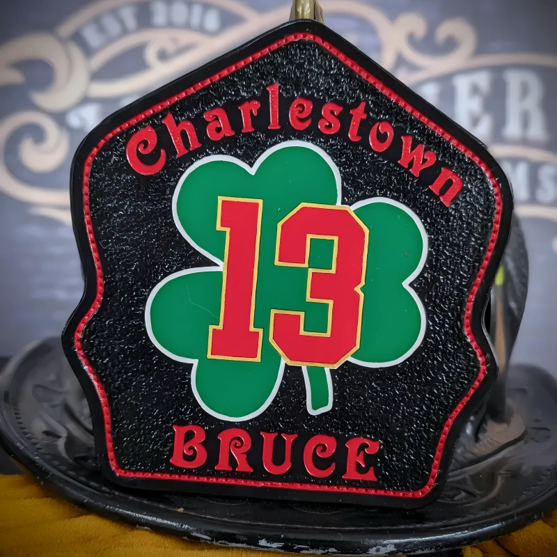 Traditional shamrock firefighter helmet shield made from leather for fire service clarity