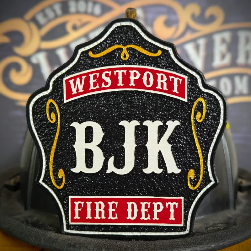Standard Issue custom leather firefighter helmet shield in black with red department panels, white lettering, and gold accent details.