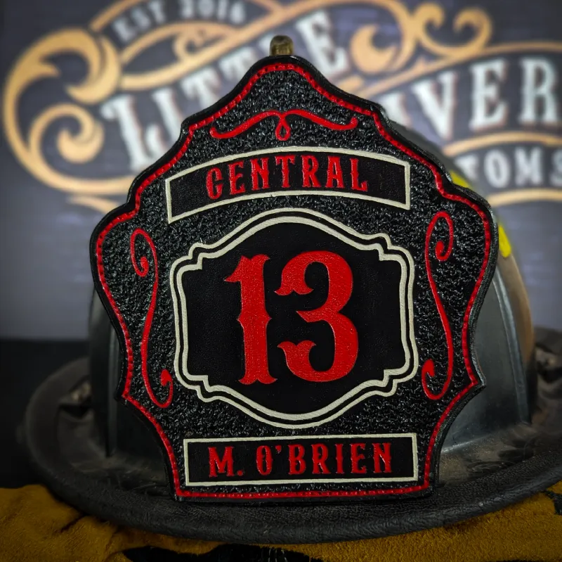 Standard Issue custom leather firefighter helmet shield in black with bold red numbers, red trim, and white outline details.