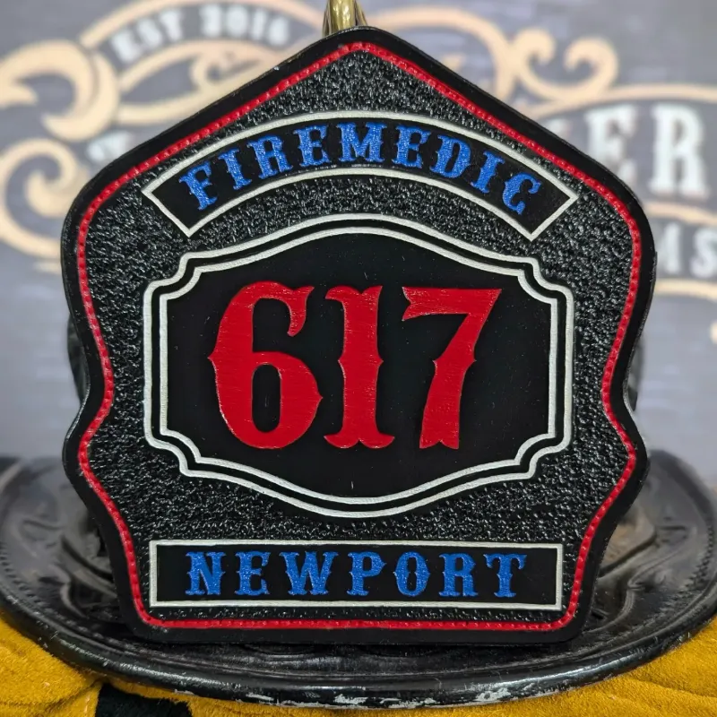 Standard Issue custom leather firefighter helmet shield for Firemedic in black with red numbers, blue panels, and white trim accents.