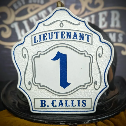 Standard Issue custom leather firefighter helmet shield for Lieutenant in white with blue numbers, blue panels, and gray trim accents.