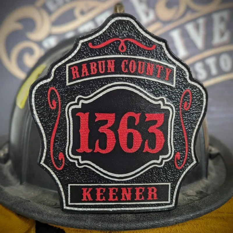 Standard Issue custom leather firefighter helmet shield in black with red numbers and Rabun County department lettering.