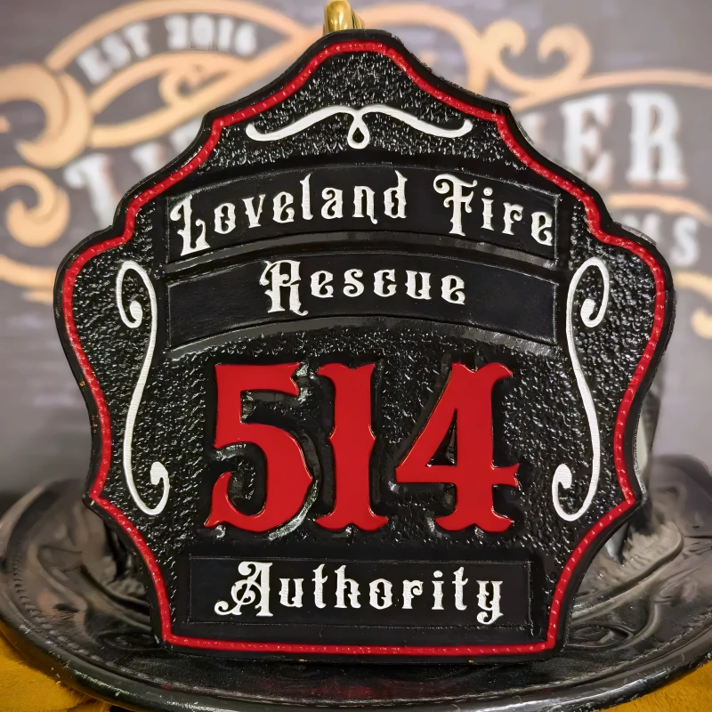 Bold firefighter helmet shield handcrafted in leather with three rocker style lettering