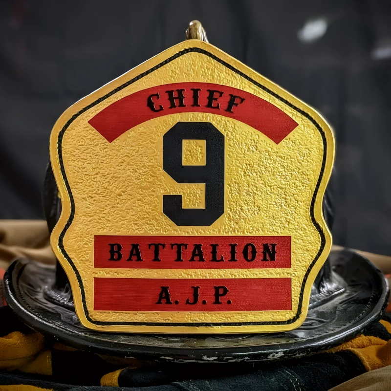 Personalized three rocker leather firefighter helmet shield crafted for department identity